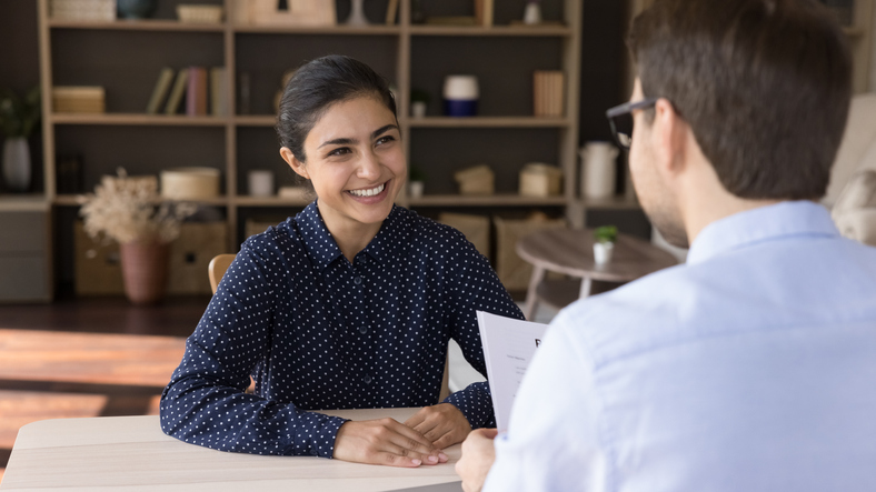 Creating a seamless and positive candidate experience. Job candidate in an interview with HR manager, ensuring a positive experience.